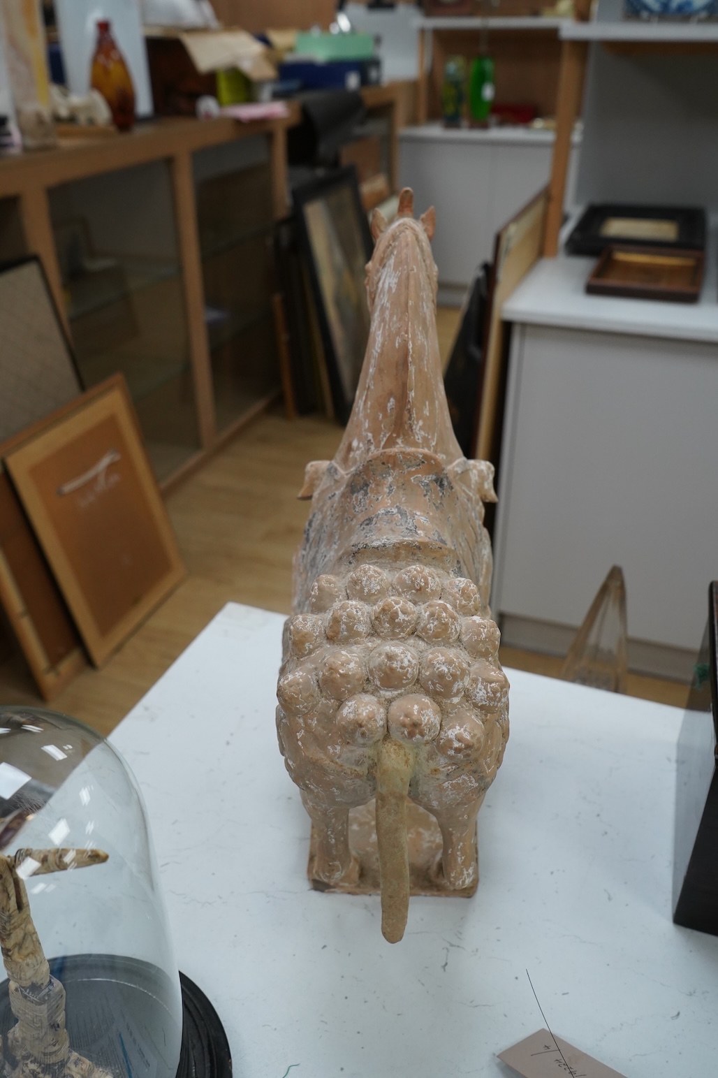 A Chinese pottery figure of a horse, Tang dynasty or later, 40cm high